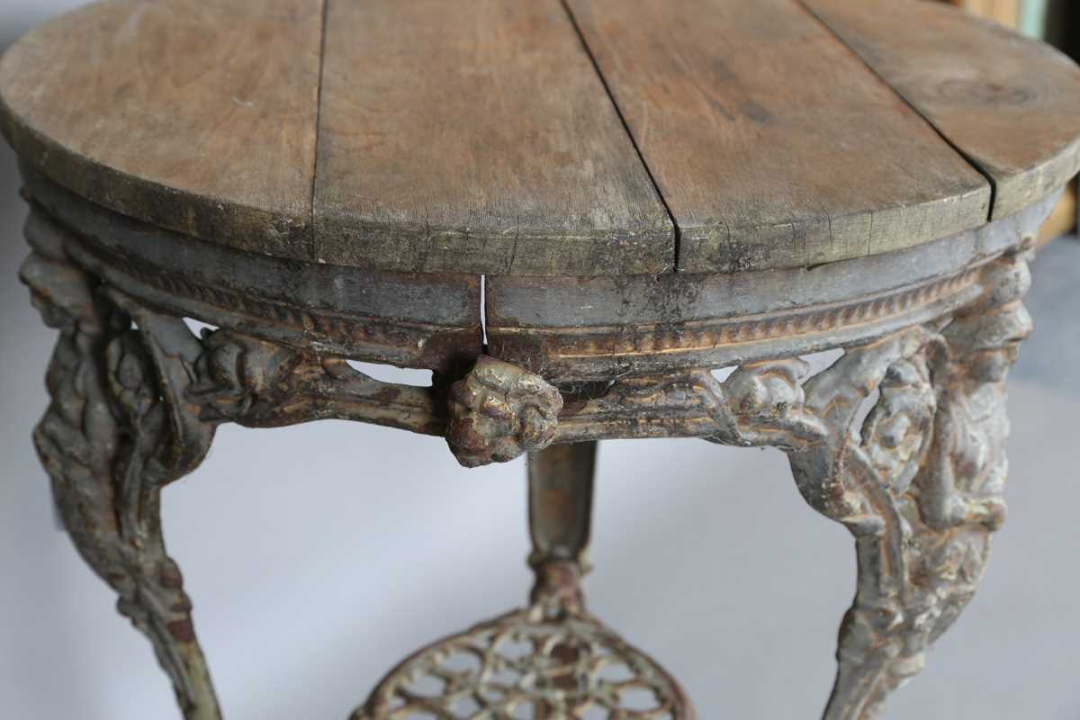 A Victorian cast iron pub table with a later wooden top and 'Britannia' legs, height 75cm, - Image 6 of 6