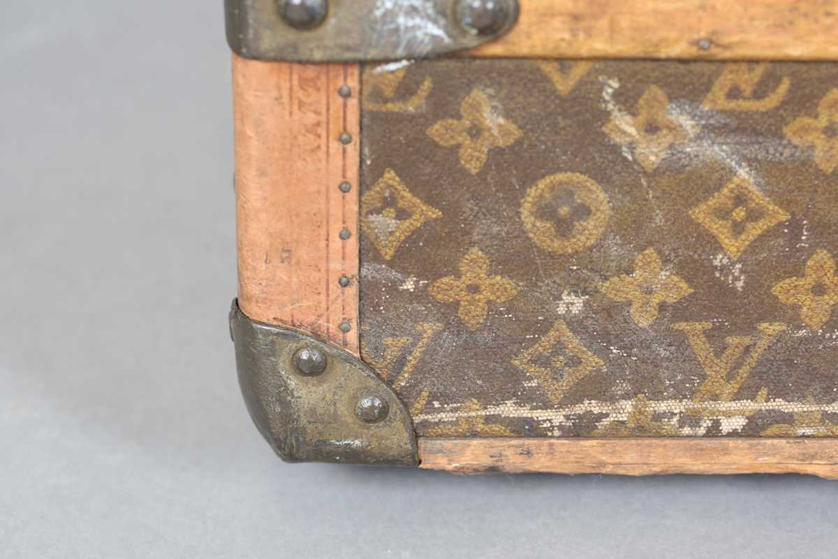 An early 20th century Louis Vuitton travelling trunk with overall monogram canvas covering and tan - Image 10 of 42
