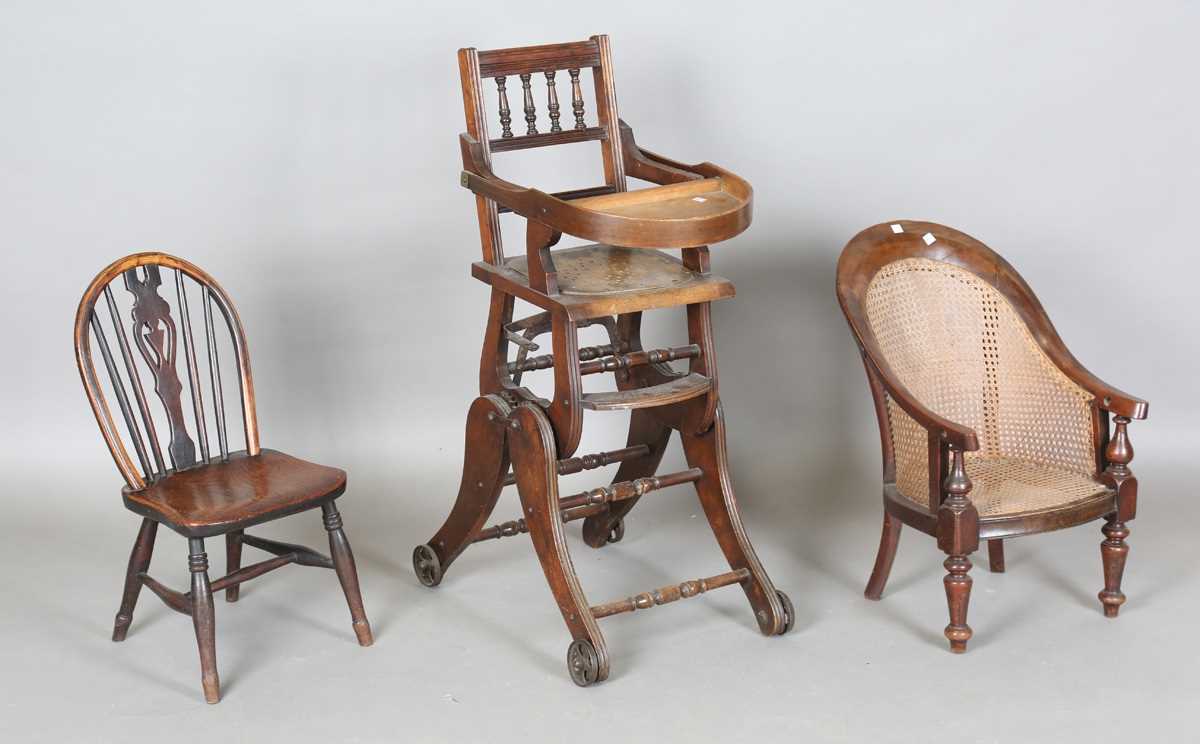 A 19th century child’s beech and elm Windsor chair, on turned legs united by stretchers, height