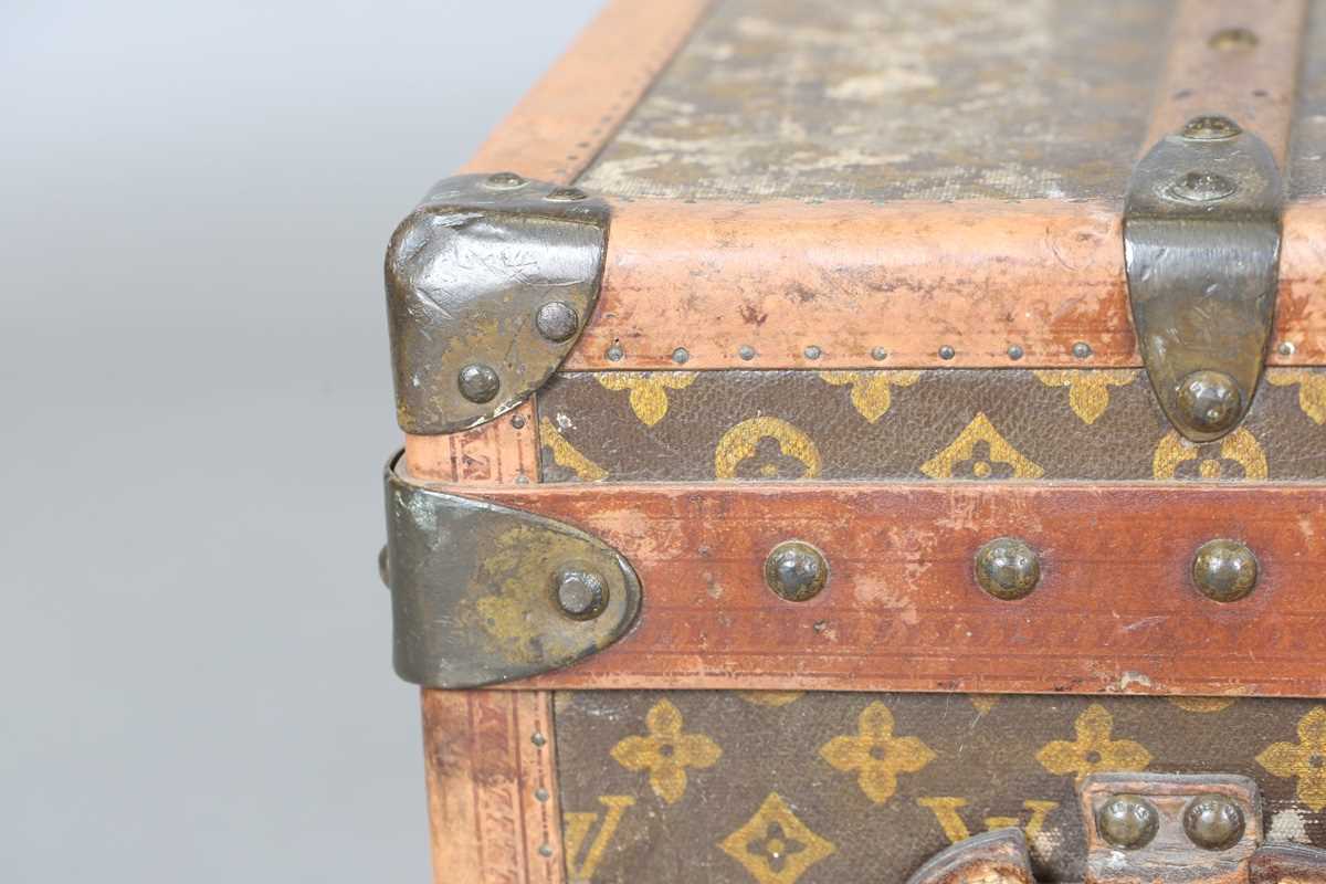An early 20th century Louis Vuitton travelling trunk with overall monogram canvas covering and tan - Image 37 of 42