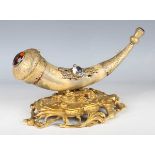 A late 19th century gilt metal and horn desk stand, inset with a citrine-coloured and clear stone,