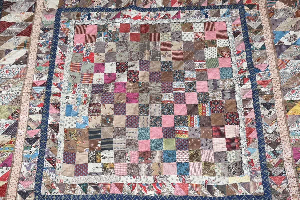 A large mid-19th century cotton 'medallion' patchwork quilt, finely worked with overall printed - Image 2 of 10