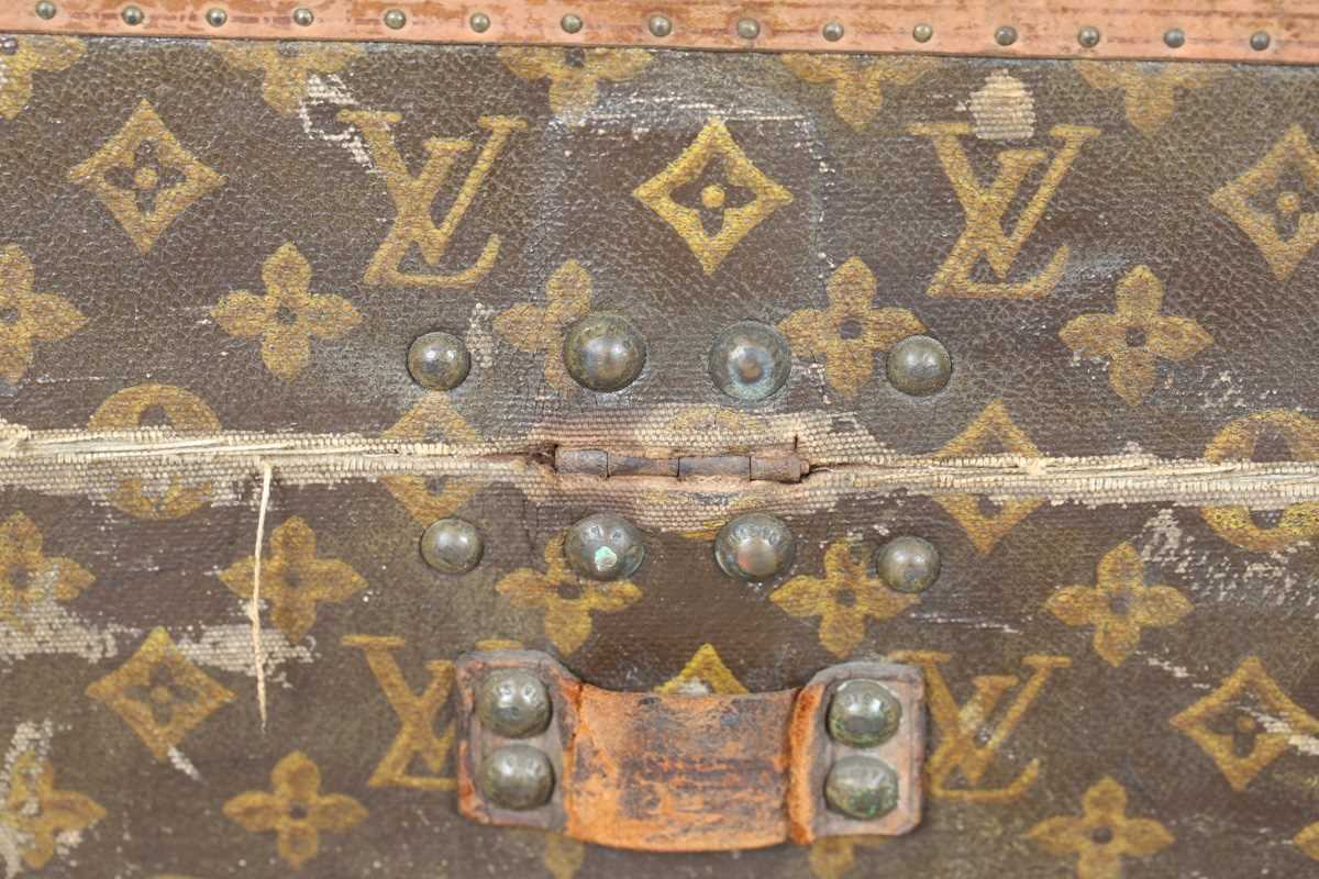 An early 20th century Louis Vuitton travelling trunk with overall monogram canvas covering and tan - Image 27 of 42