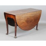 A George III mahogany oval drop-flap breakfast table, the tapering legs with carved lappet shoulders