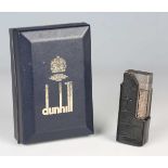 A silver plated Dunhill pocket lighter with overall machined surface, length 6.4cm, cased,