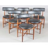 A set of six mid-20th century G-Plan teak framed dining chairs with black leatherette seat and