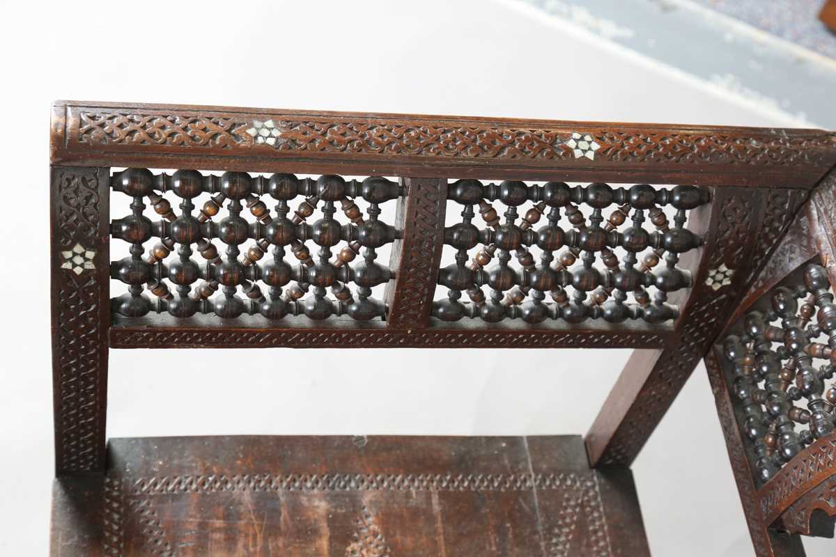 A late 19th century Middle Eastern hardwood and mother-of-pearl inlaid window seat, similar to those - Image 8 of 19