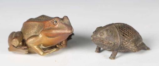 An early 20th century patinated cast bronze model of a frog, length 8cm, together with an African