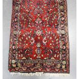 A Hamadan runner, North-west Persia, mid-20th century, the red field with overall scattered foliage,