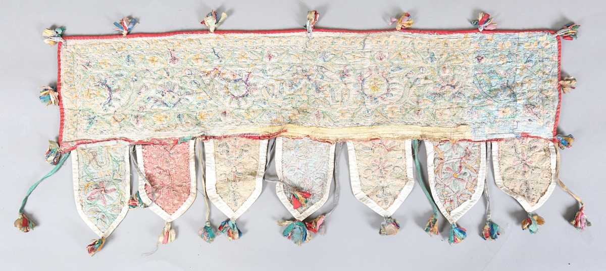 An Indian kutch embroidered door hanging, finely worked in coloured threads, width 98cm. Provenance: - Image 6 of 6