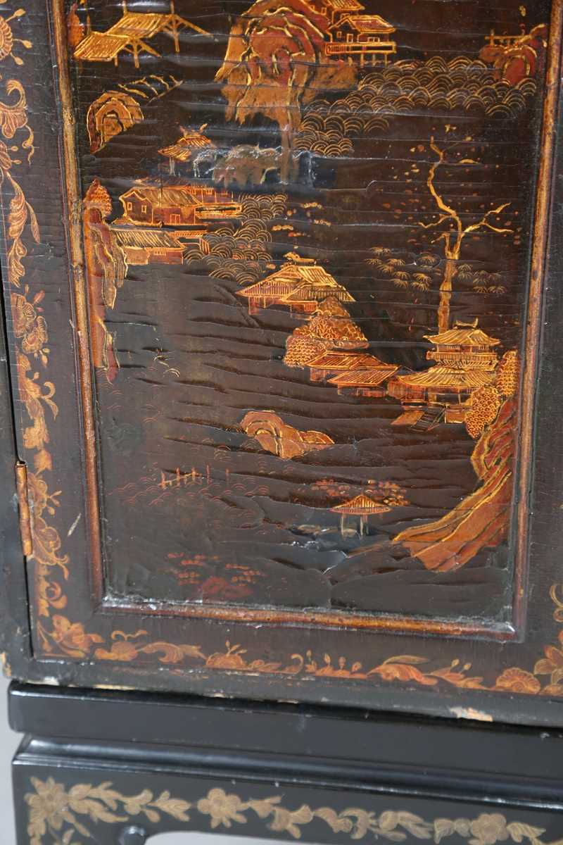 An 18th century Chinese black lacquered collector's cabinet, decorated in gilt with landscape - Image 20 of 28