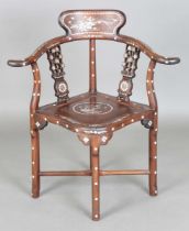 A Chinese hardwood and mother-of-pearl inlaid corner armchair, height 86cm, width 79cm, depth 55cm.