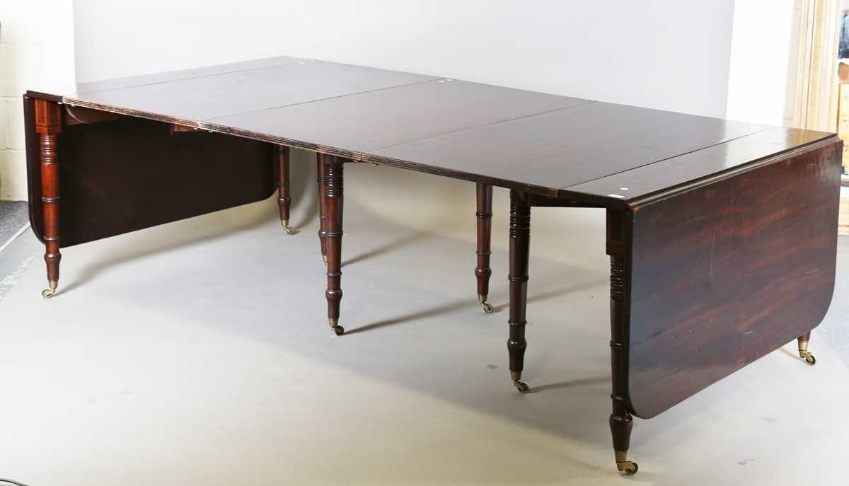 A Regency mahogany concertina-action extending dining table, in the manner of Wilkinson of - Image 10 of 16