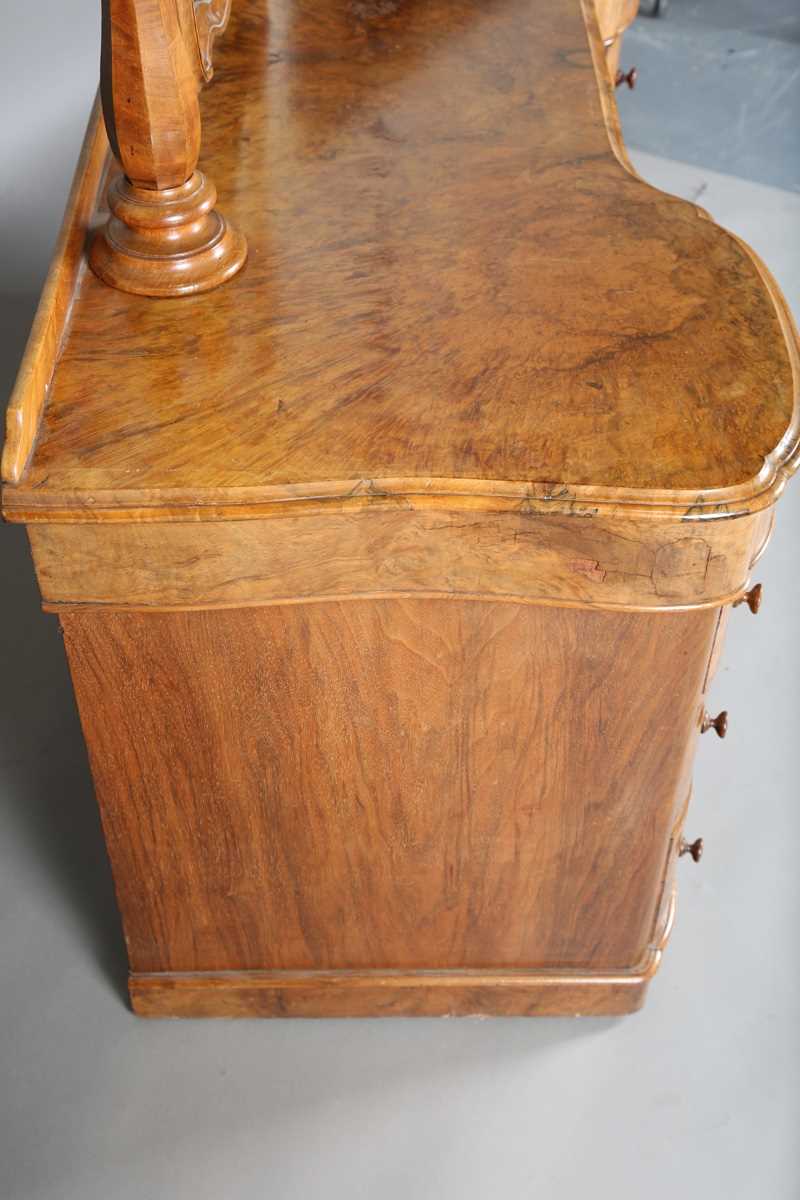 A mid-Victorian burr walnut kneehole dressing table, fitted with a swing mirror above an arrangement - Image 8 of 13