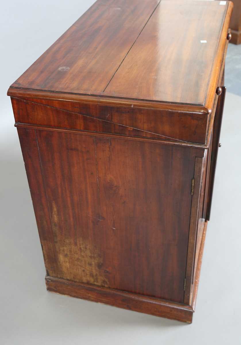 An early Victorian mahogany wash cabinet, fitted with a hinged lid above two arch panelled doors, - Image 11 of 14
