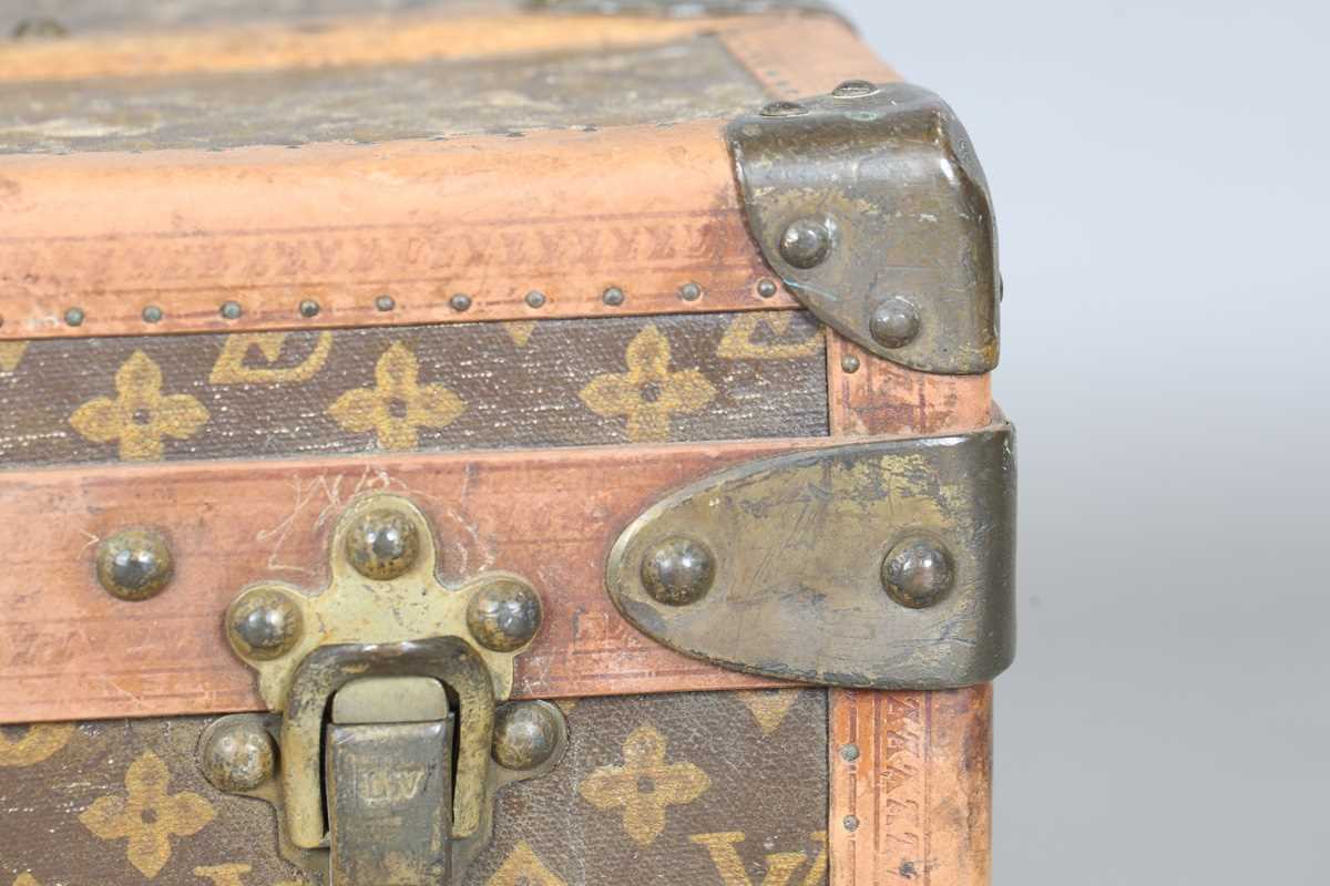 An early 20th century Louis Vuitton travelling trunk with overall monogram canvas covering and tan - Image 8 of 42