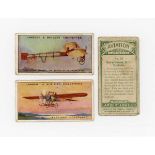 A collection of cigarette and trade cards in two albums of transportation interest, including a