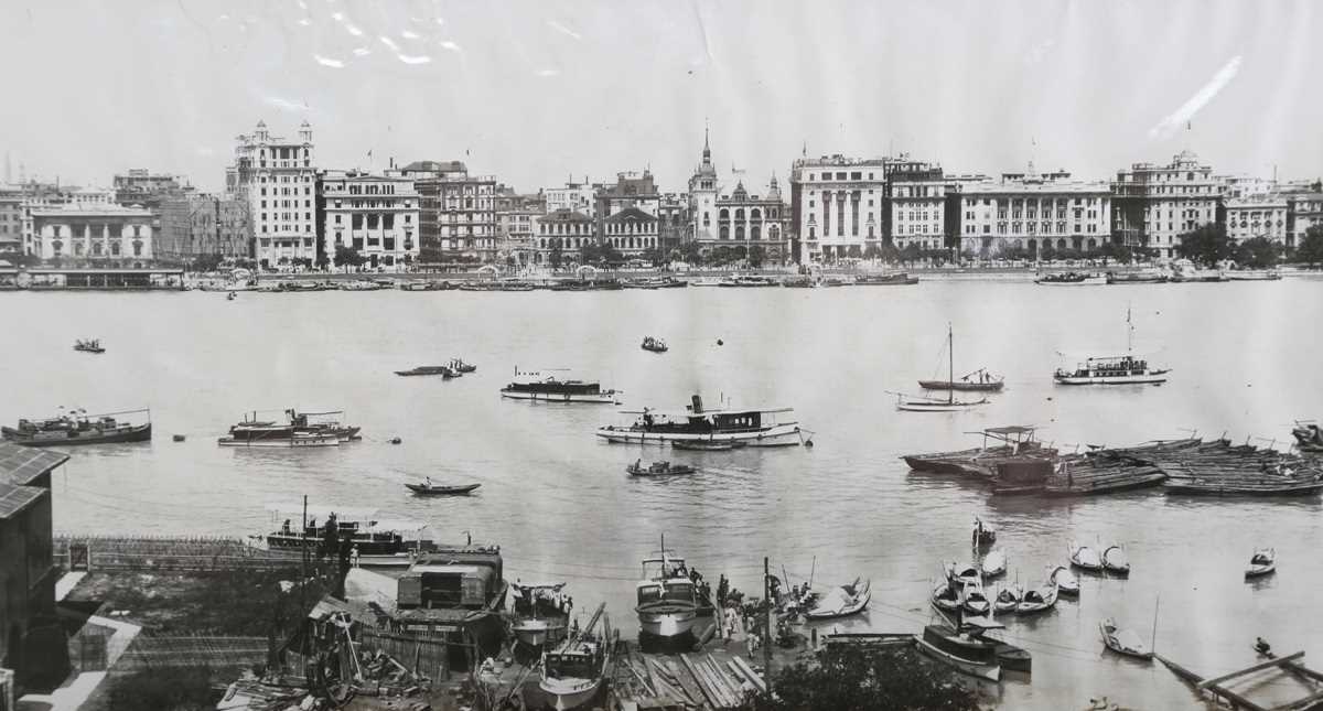 PHOTOGRAPHS. Two black and white photographs depicting panoramas of Shanghai harbour one titled ‘