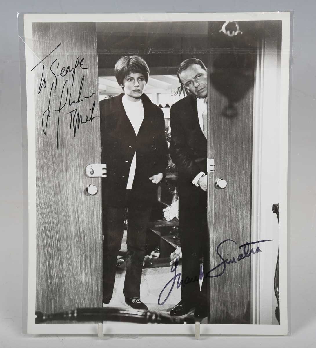 AUTOGRAPH. An autographed black and white photograph signed by Frank Sinatra and Jacqueline Bisset