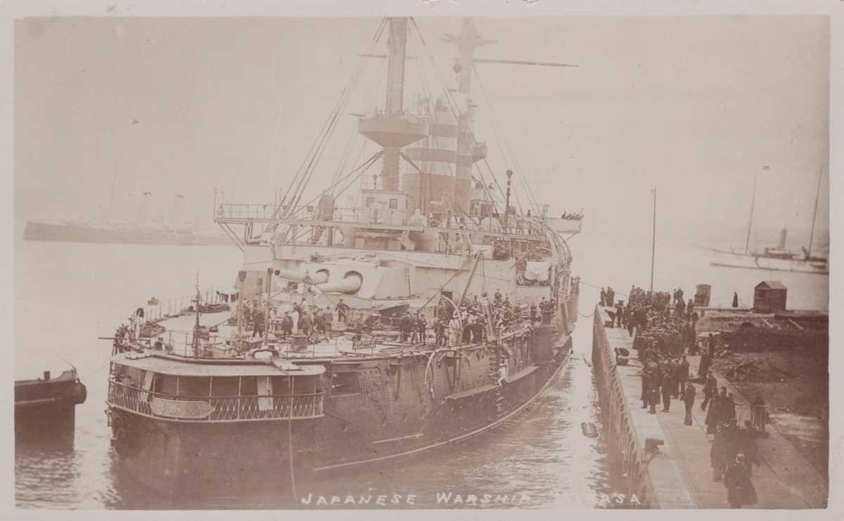 An album containing approximately 120 postcards and numerous photographs of naval interest, the