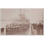 An album containing approximately 120 postcards and numerous photographs of naval interest, the