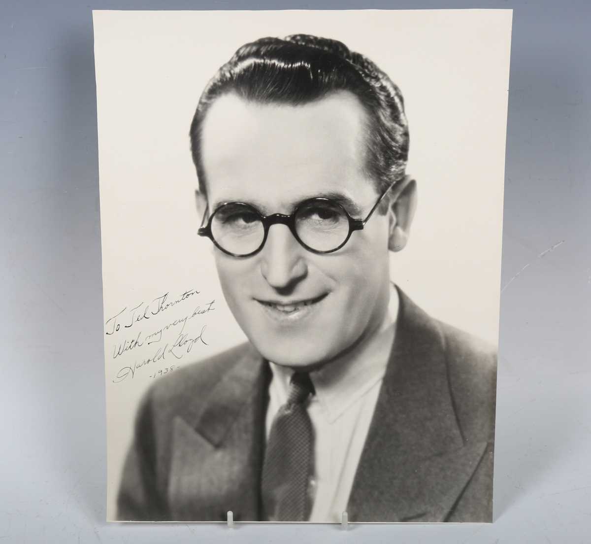 AUTOGRAPH. An autographed black and white oversized photograph signed by Harold Lloyd and