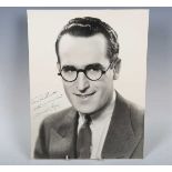 AUTOGRAPH. An autographed black and white oversized photograph signed by Harold Lloyd and