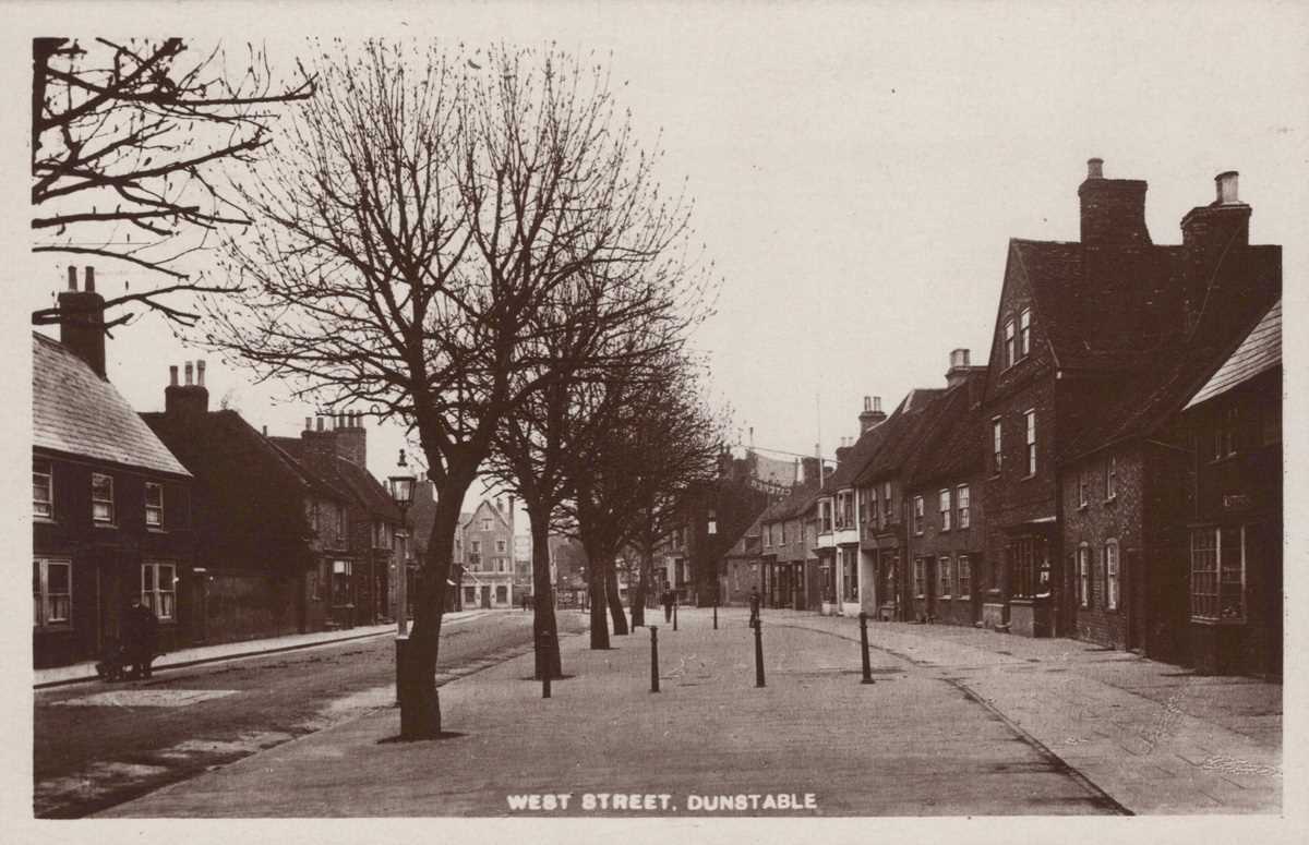 A collection of 26 postcards of Bedfordshire including photographic postcards titled ‘West Street,