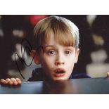 AUTOGRAPH. An oversized colour photograph signed by Macaulay Culkin in Home Alone 2, 28cm x 35.5cm.