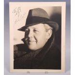 AUTOGRAPH. An autographed black and white oversized photograph signed by Charles Laughton and