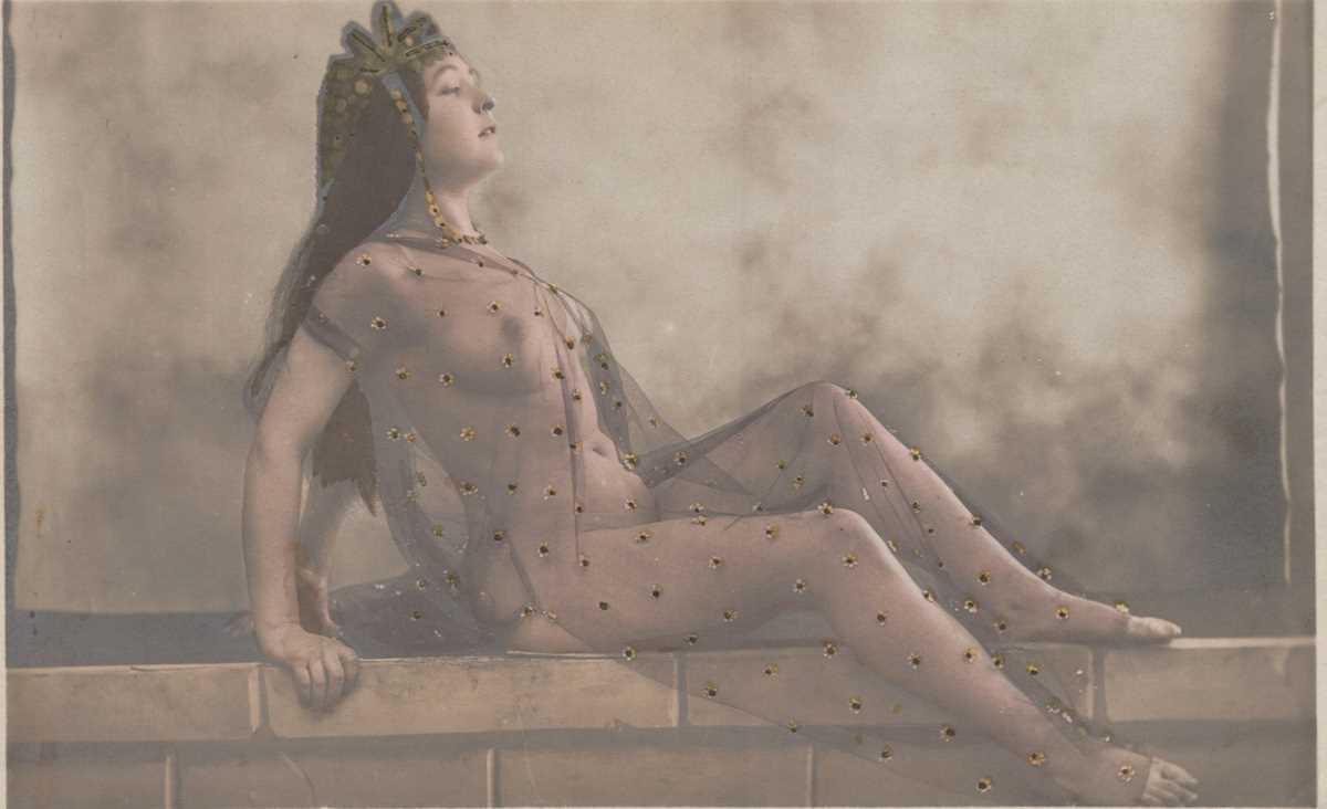 A collection of 27 hand-tinted postcards of erotic or risqué interest, most photographic.
