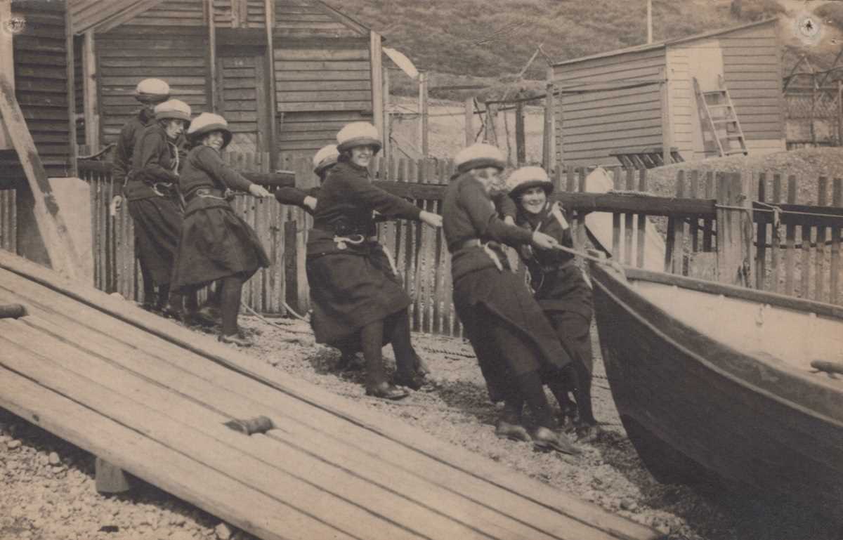 A collection of 16 photographic postcards of girl Sea Scouts.