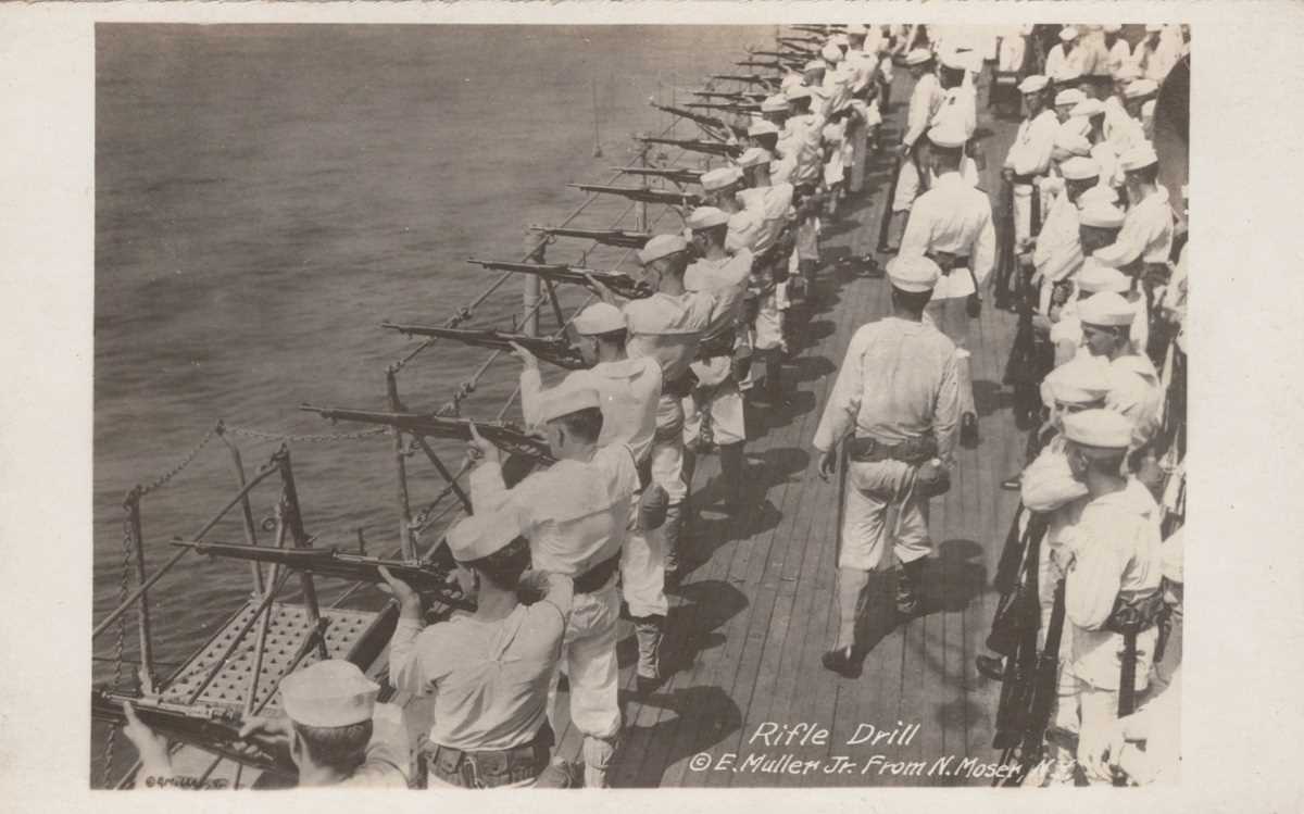 Two albums containing approximately 140 postcards and numerous photographs of American naval