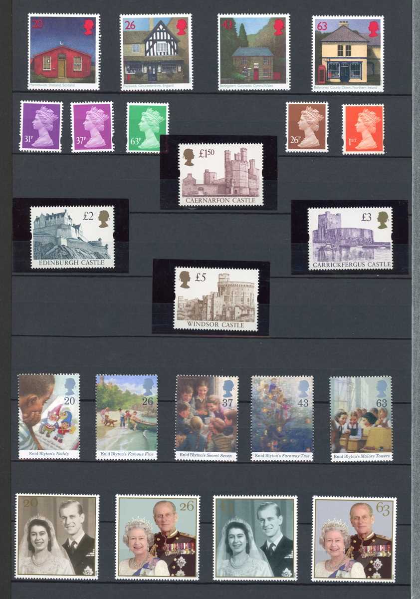 Great Britain decimal mint stamps in two stock books up to 2014 plus year books (22) 1988-2001 (face