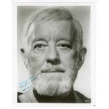 AUTOGRAPH, STAR WARS. A signed black and white photograph of Alec Guinness in costume as Obi Wan