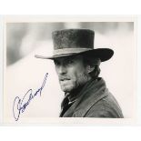 AUTOGRAPH. A signed black and white photograph of Clint Eastwood in costume for Pale Rider, 20cm x