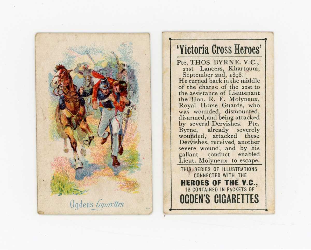 A collection of cigarette and trade cards in three albums, mostly of military interest, including 12