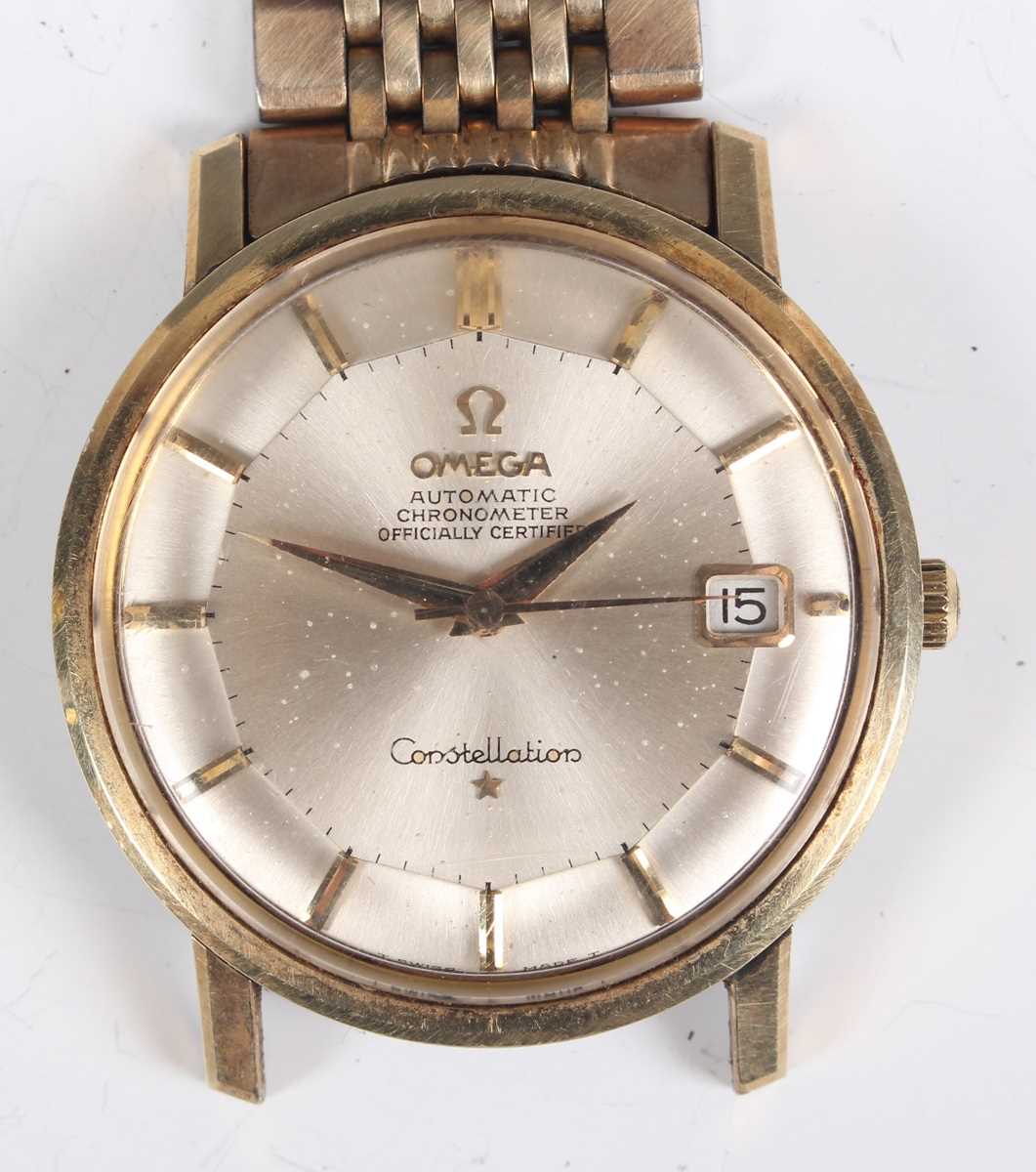 An Omega Automatic Constellation gilt metal gentleman's bracelet wristwatch, the signed silvered