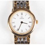 An Omega De Ville steel and gilt lady's bracelet wristwatch with signed dial, the bracelet with