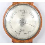 An early Victorian rosewood wheel barometer of oversized proportions with silvered dial,