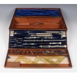 A late Victorian burr walnut drawing instrument box, fitted with two detachable trays containing