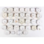 A collection of thirty-two pocket watch movements and dials, including one signed 'Arnold & Dent
