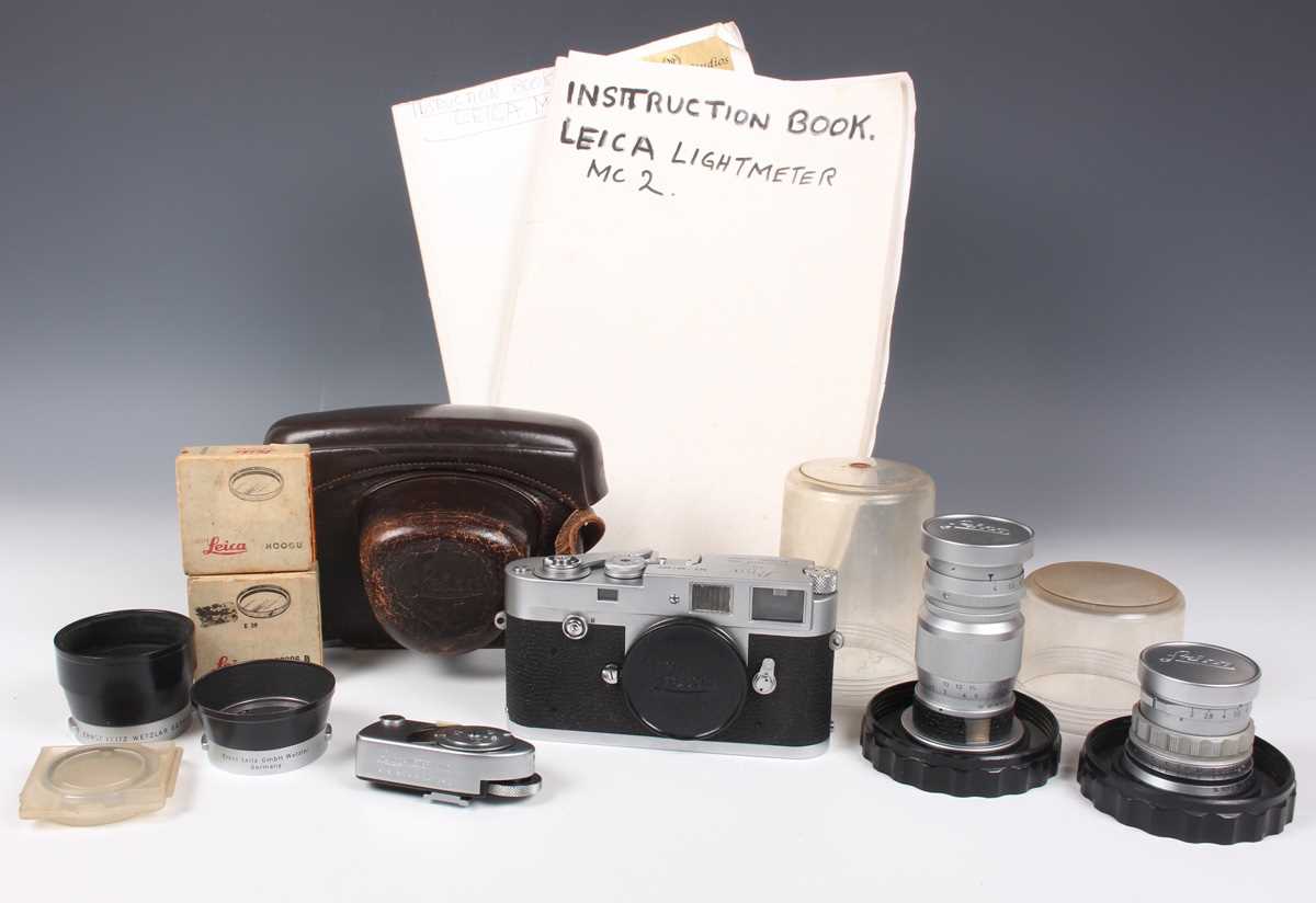 A Leica M2 camera, No. 961400, circa 1959, with leather case, together with a Leitz Elmar 1:4/90