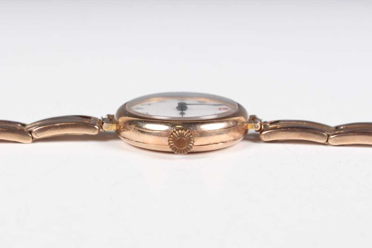 A 9ct gold circular cased lady's wristwatch, the enamelled dial with Arabic numerals, on a sprung - Image 9 of 10