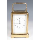 A mid-19th century French brass one piece cased carriage timepiece with eight day movement, the