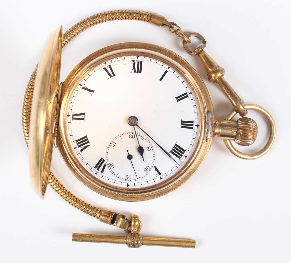 An 18ct gold half-hunting cased keyless wind gentleman’s pocket watch, the jewelled lever movement