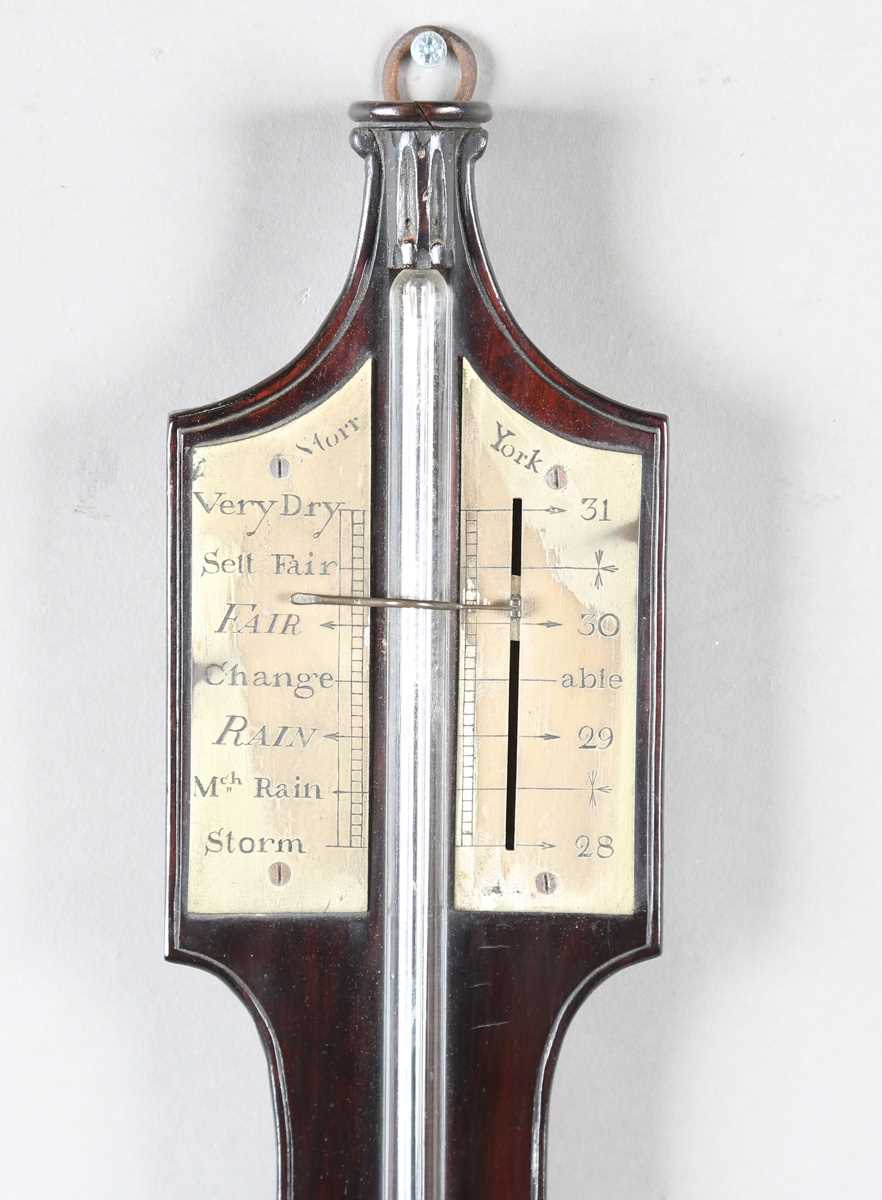 A late George III mahogany stick barometer, the silvered dial with vernier scale and signed 'Storr