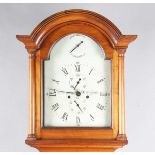 An early 19th century mahogany longcase clock with eight day movement striking on a bell, the 12-