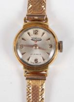 A Waltham gilt metal fronted and steel backed lady’s wristwatch, the signed silvered dial with