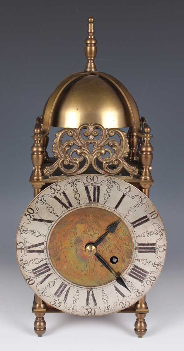 A 20th century brass lantern clock with eight day fusee movement, the silvered chapter ring with